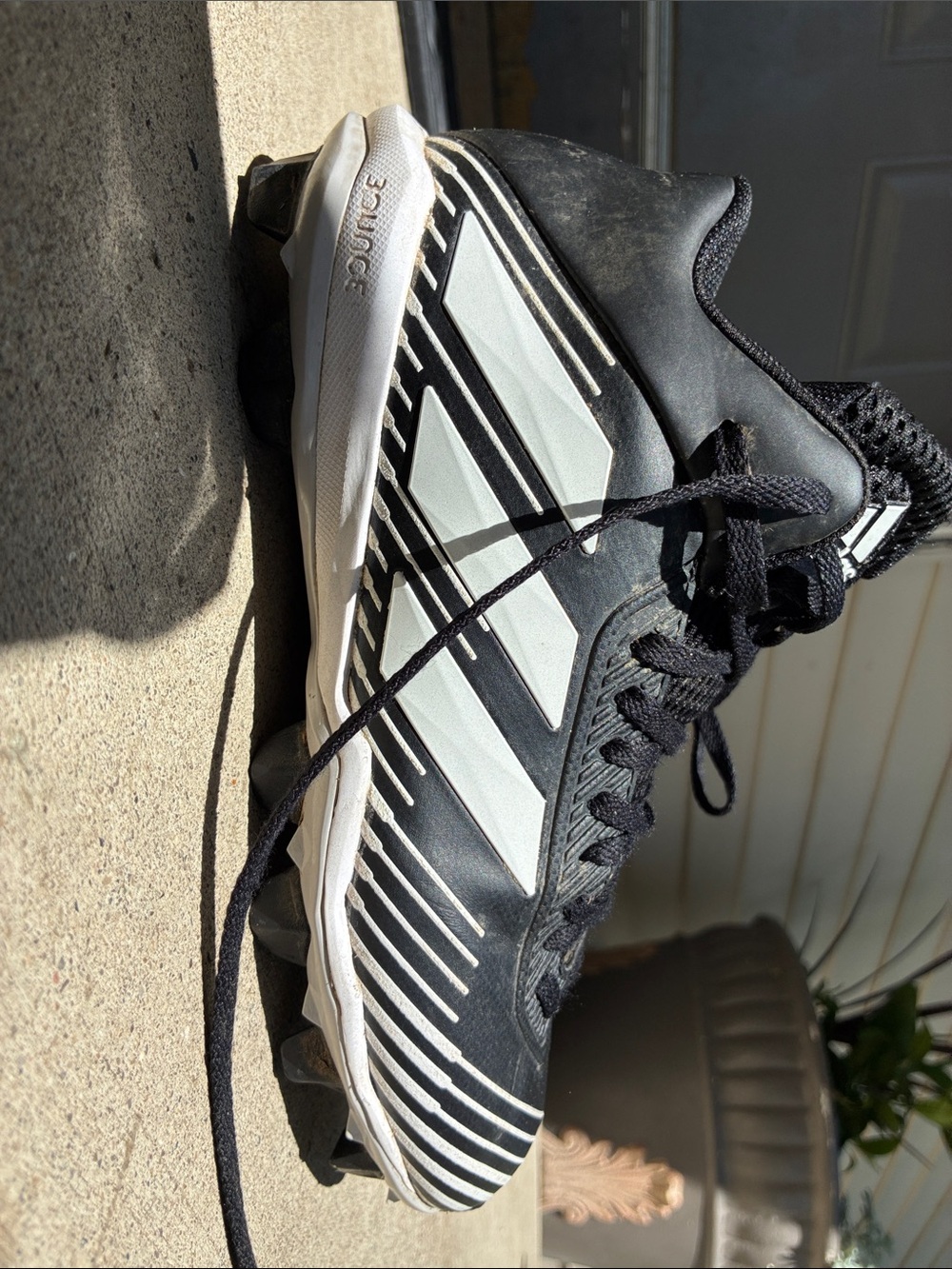 adidas Black and White Soccer Cleats with Striped Three-Stripe Detail